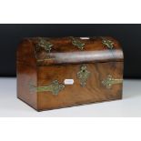 Victorian Walnut Domed Stationery Box with brass strapwork mounts, the hinged lid opening to a