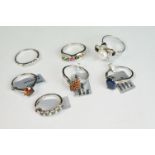 A collection of seven contemporary sterling silver ladies rings.