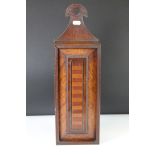 An antique wall hanging candle box made from mixed woods, total height measures approx 46cm.