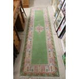 Moroccan Green Ground Wool Runner, 280cm x 78cm together with three small rugs / prayer rugs