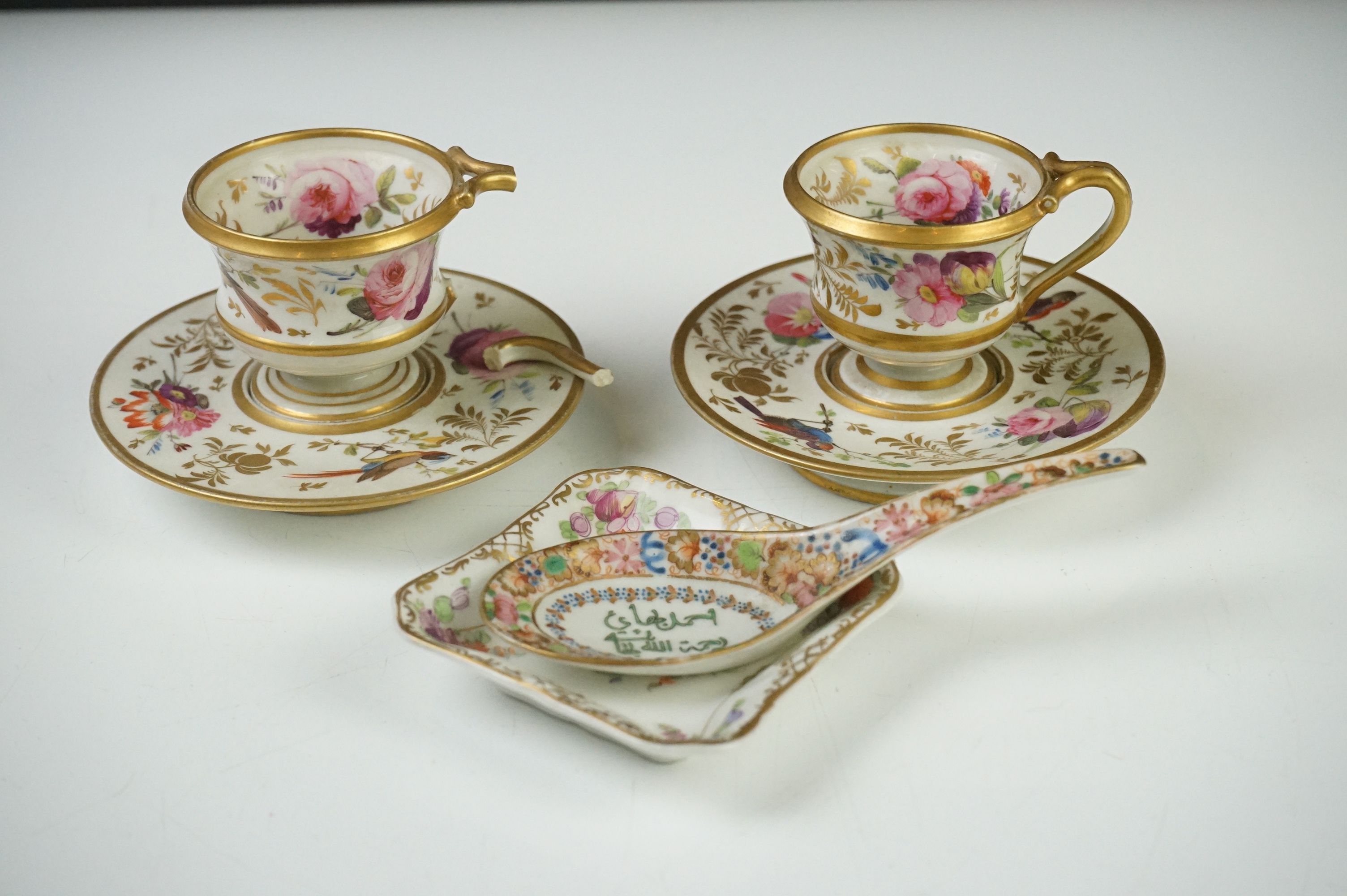 Pair of Continental Porcelain Cabinet Cups and Saucers decorated in gilt and enamels with flowers