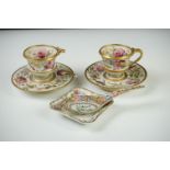 Pair of Continental Porcelain Cabinet Cups and Saucers decorated in gilt and enamels with flowers