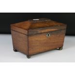 Regency Rosewood Tea Caddy of sarcophagus form, raised on brass ball feet, 21cm wide