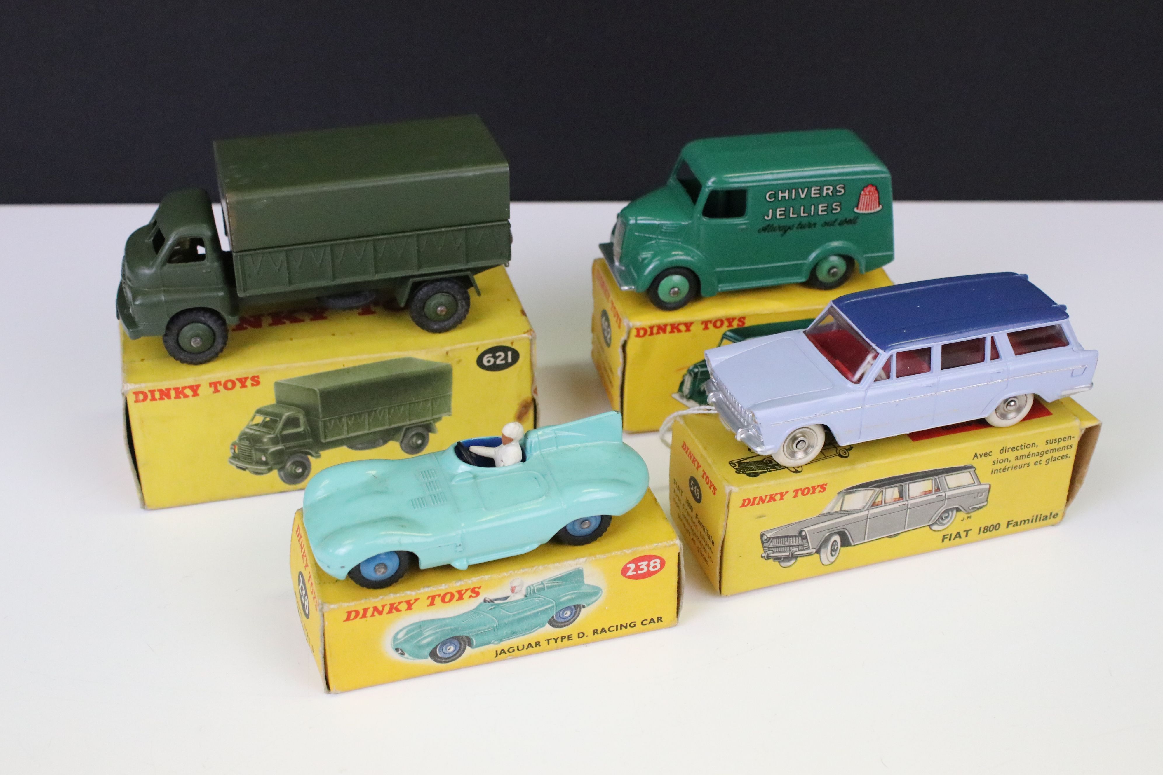 Four boxed Dinky diecast models to include 238 Jaguar Type D Racing Car in turquoise with driver (no