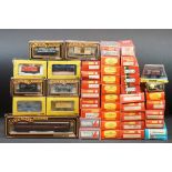 33 Boxed OO gauge items of rolling stock featuring coaches, wagons and vans to include 29 x Hornby /