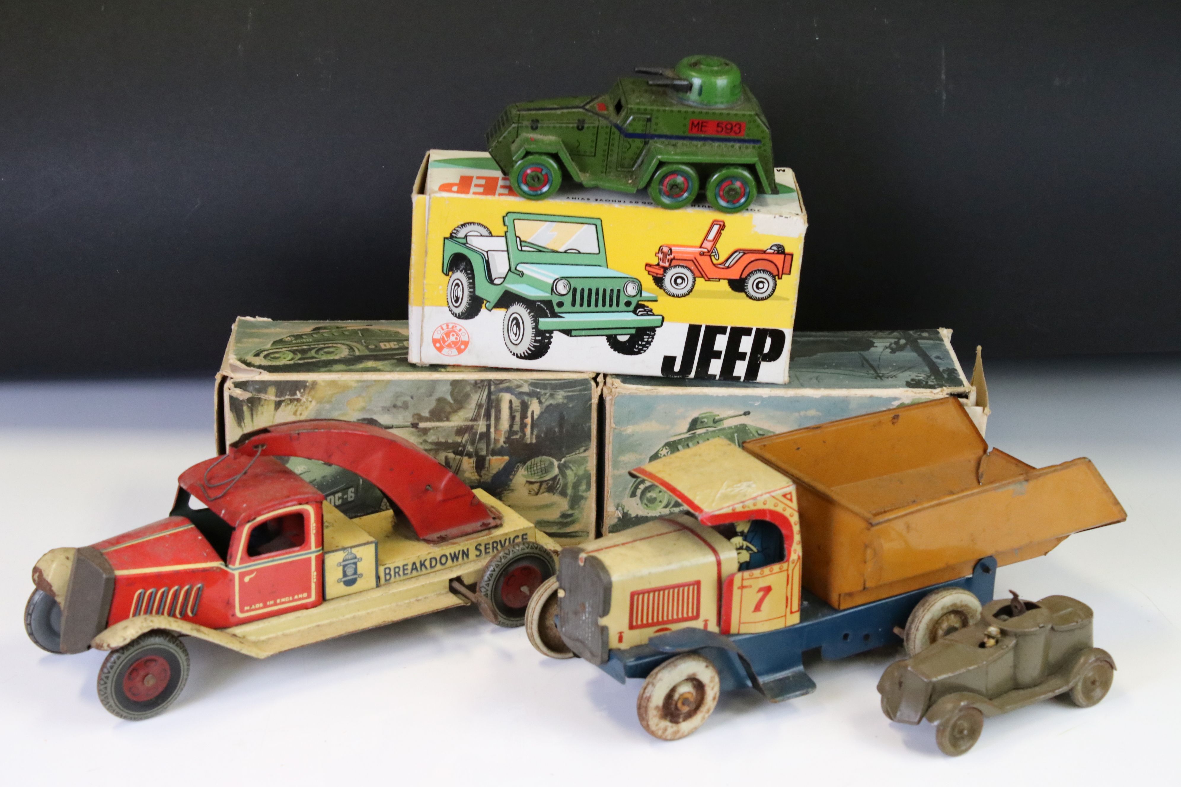 Seven mid 20th C tin plate models to include 2 x boxed 690 U.S. Armoured Half Tracks, boxed Ites