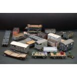 24 O gauge items of kit built rolling stock featuring flatbeds, trucks and vans, plastic & metal
