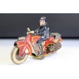 Mid 20th C tin plate and wind up police patrol motor cyclist and motorcycle, with Dunlop tyres,