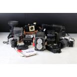 A collection of Cameras And Photographic equipment to include a Rolleicord medias format camera,