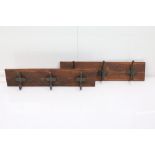 Two Sets of Three Iron Coats mounted on Two Pine Boards, each 78cm long