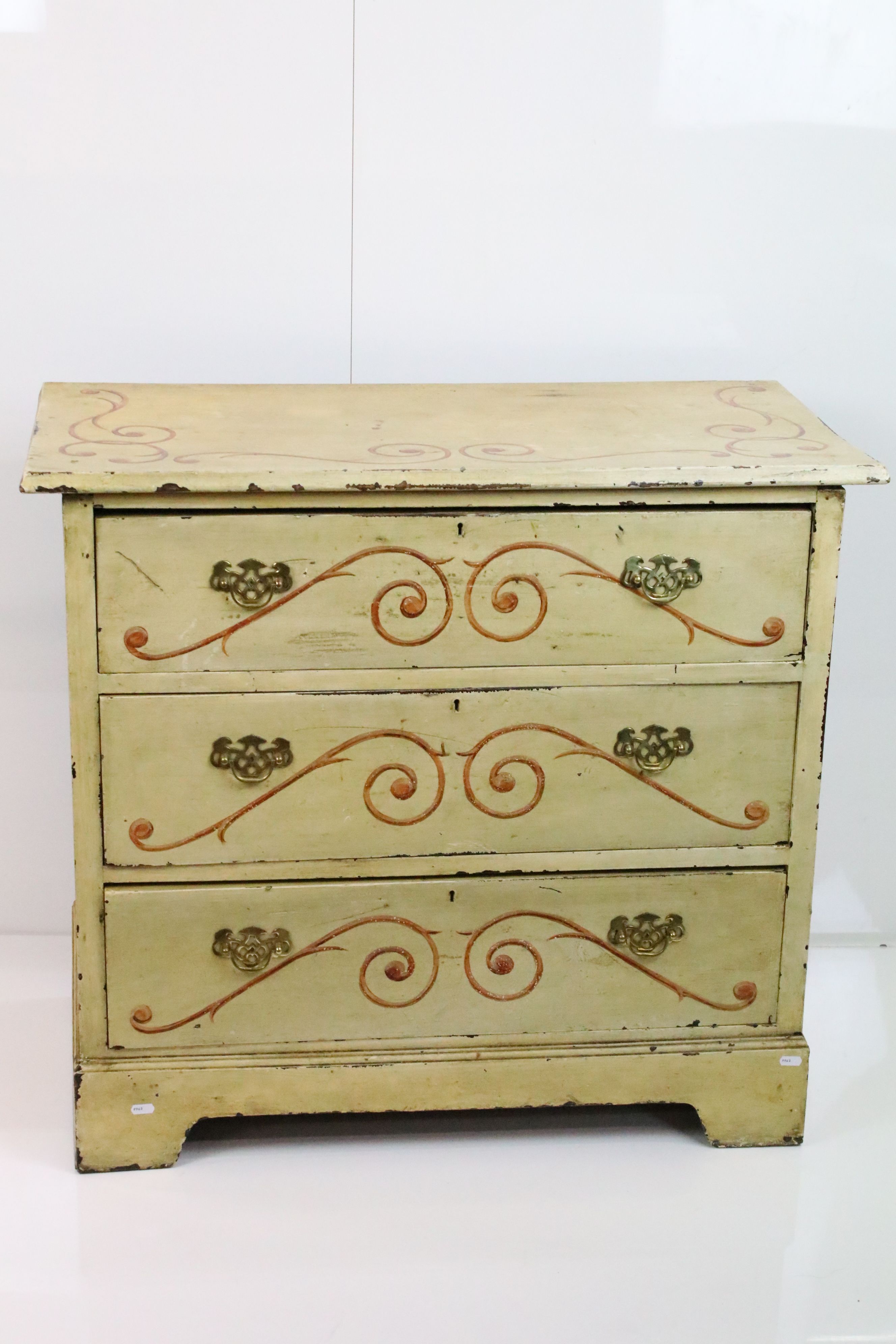 Victorian Yellow Painted Pine Chest of Three Long Drawers with painted scroll work decoration,