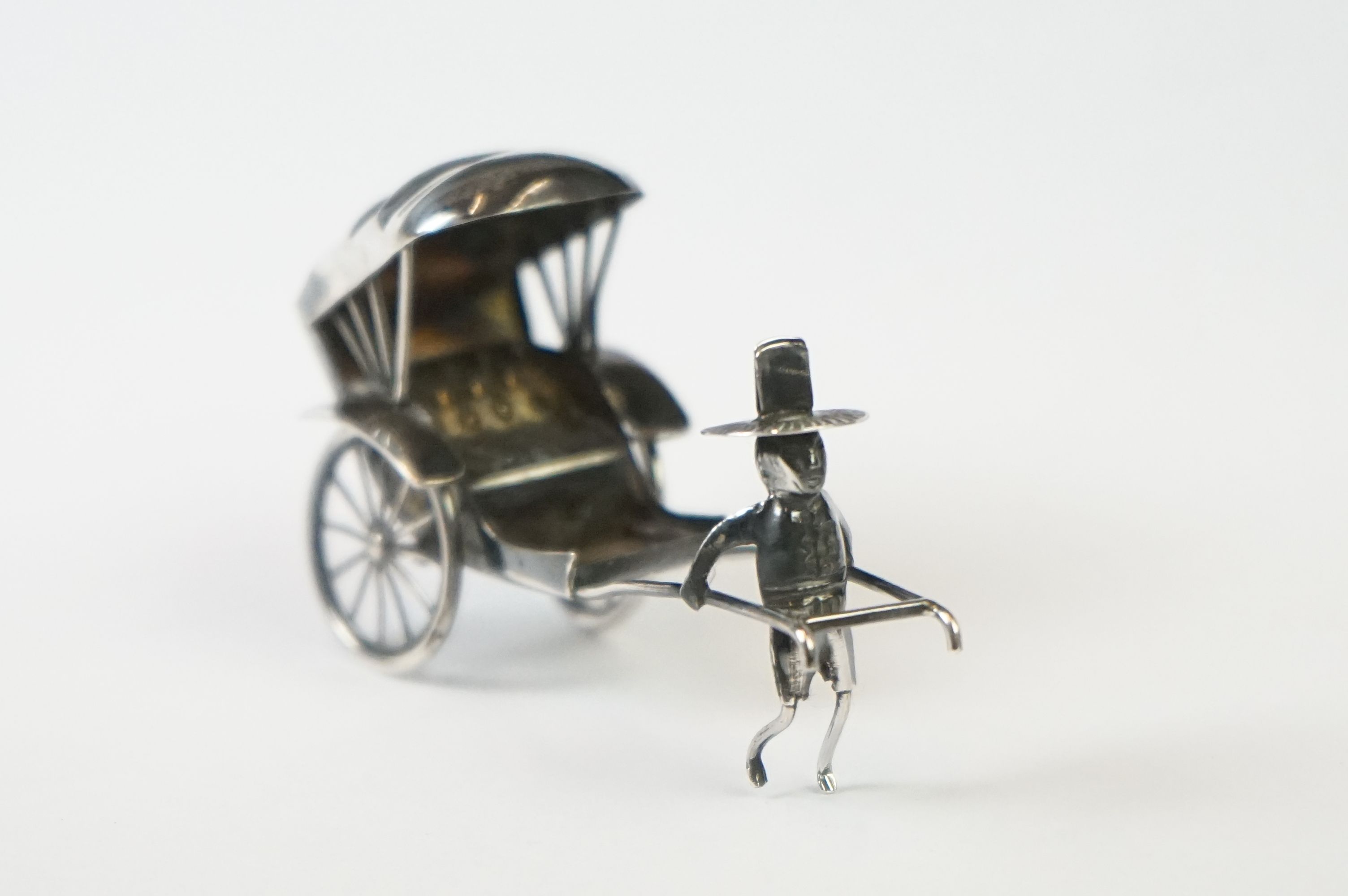 A Chinese sterling silver ornament of a man pulling a rickshaw. - Image 8 of 9