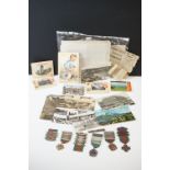 A small group of mixed collectables to include early to mid 20th century postcards and a