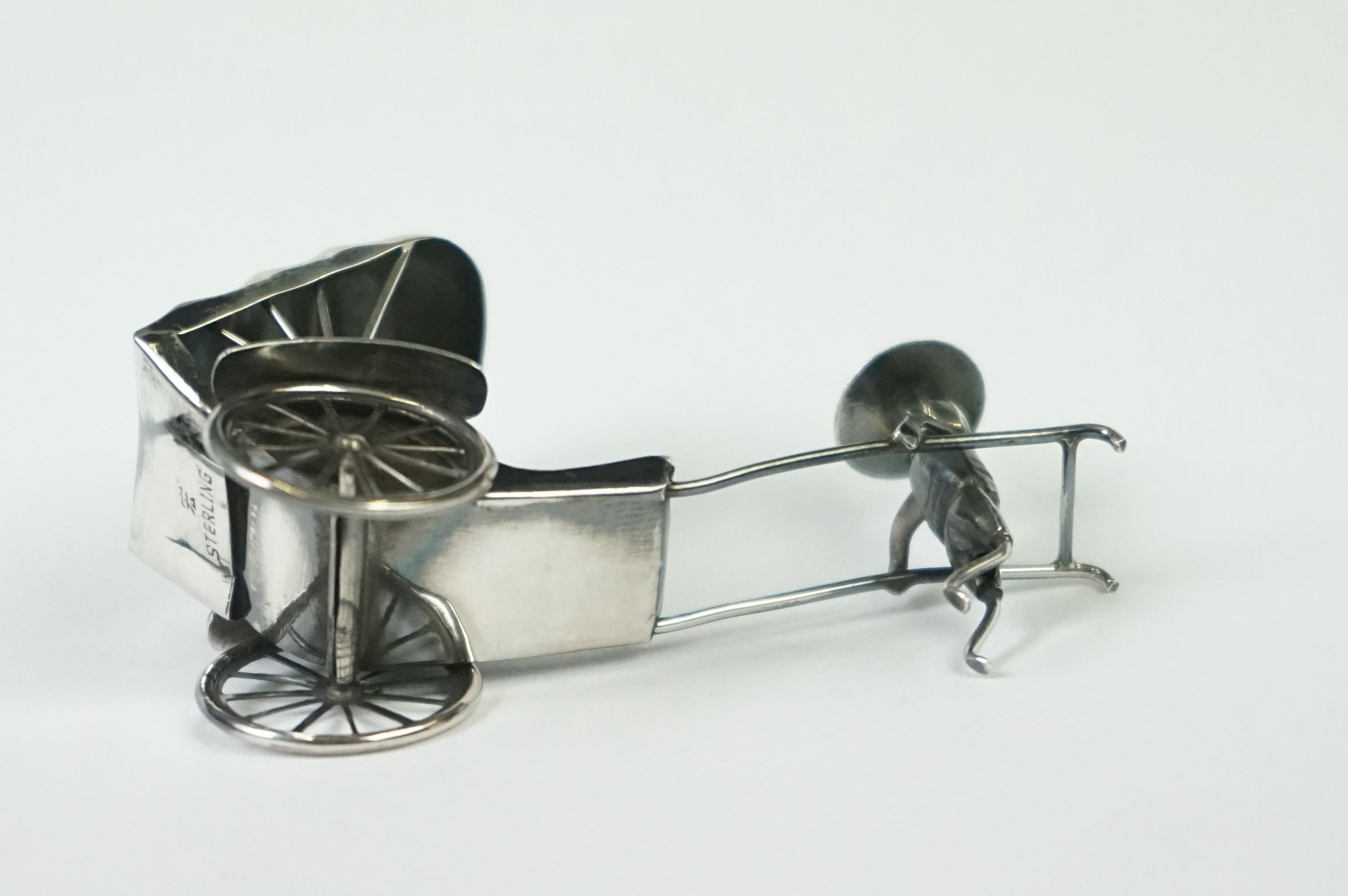 A Chinese sterling silver ornament of a man pulling a rickshaw. - Image 6 of 9