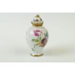 A miniature hand painted porcelain lidded vase, marked Dresden to base.