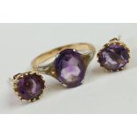A yellow metal amethyst set dress ring together with earrings.