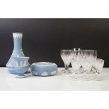 Three pieces of Wedgwood Jasperware in pale blue to include a tapering vase (19cm high), urn-