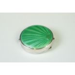 A fully hallmarked sterling silver and enamel Art Deco powder compact with green guilloche