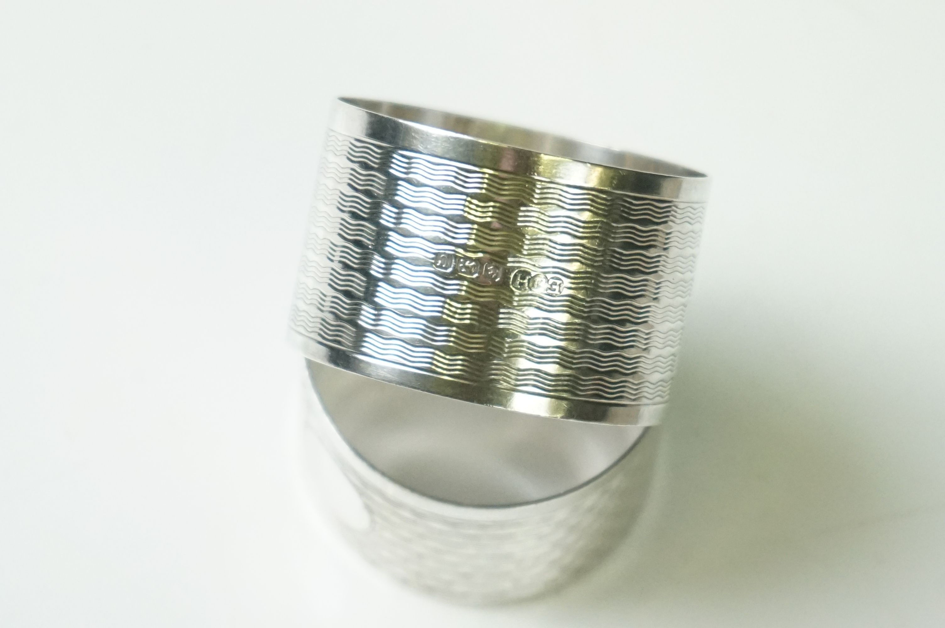 A pair of fully hallmarked sterling silver napkin rings with engine turned decoration and original - Image 4 of 7