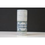 Troika Pottery cylindrical vase, decorated with a disc band on textured blue tone ground, signed '