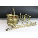 A brass fireside companion set together with brass firedogs and brass coal bucket.