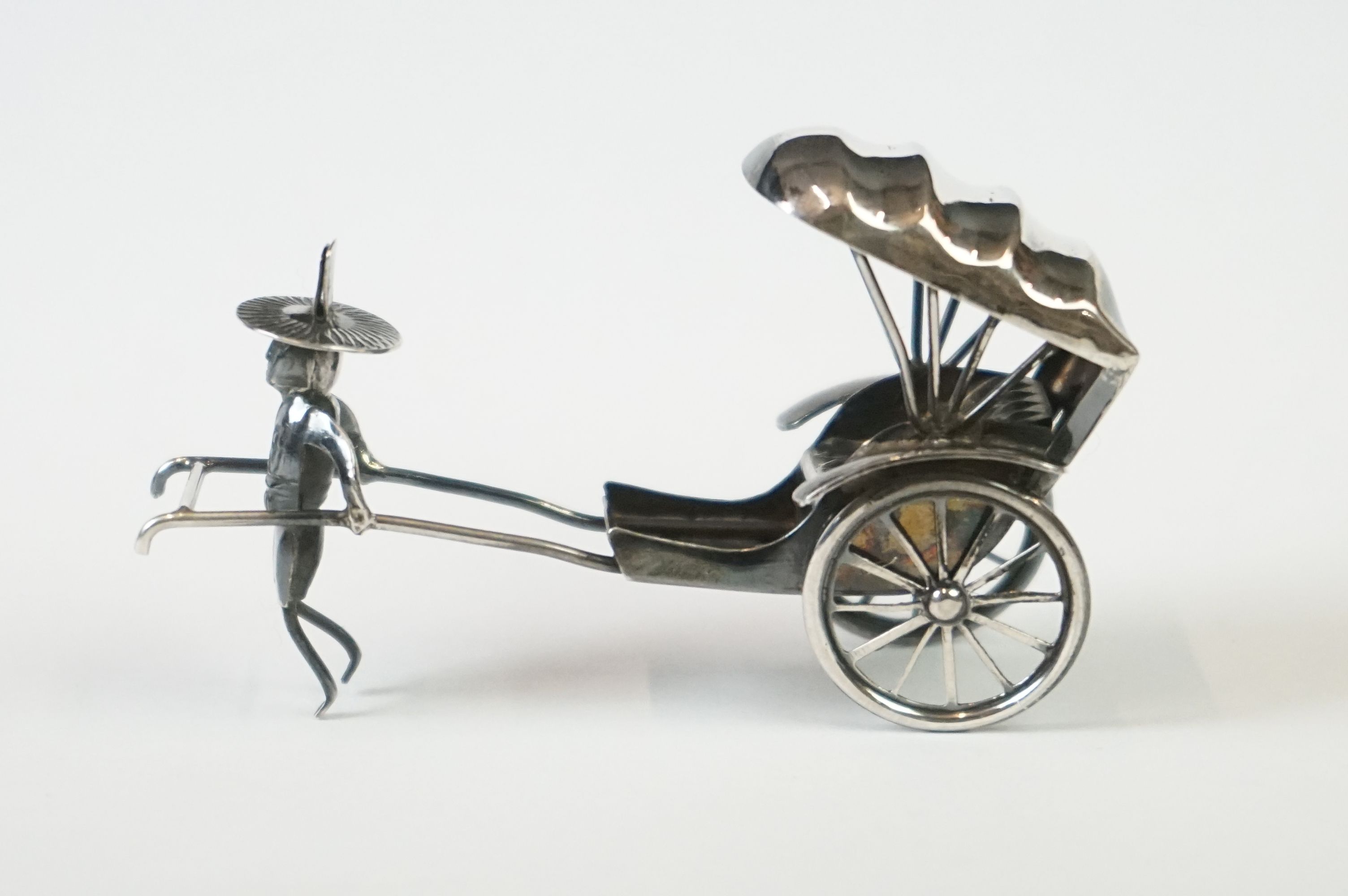 A Chinese sterling silver ornament of a man pulling a rickshaw. - Image 9 of 9