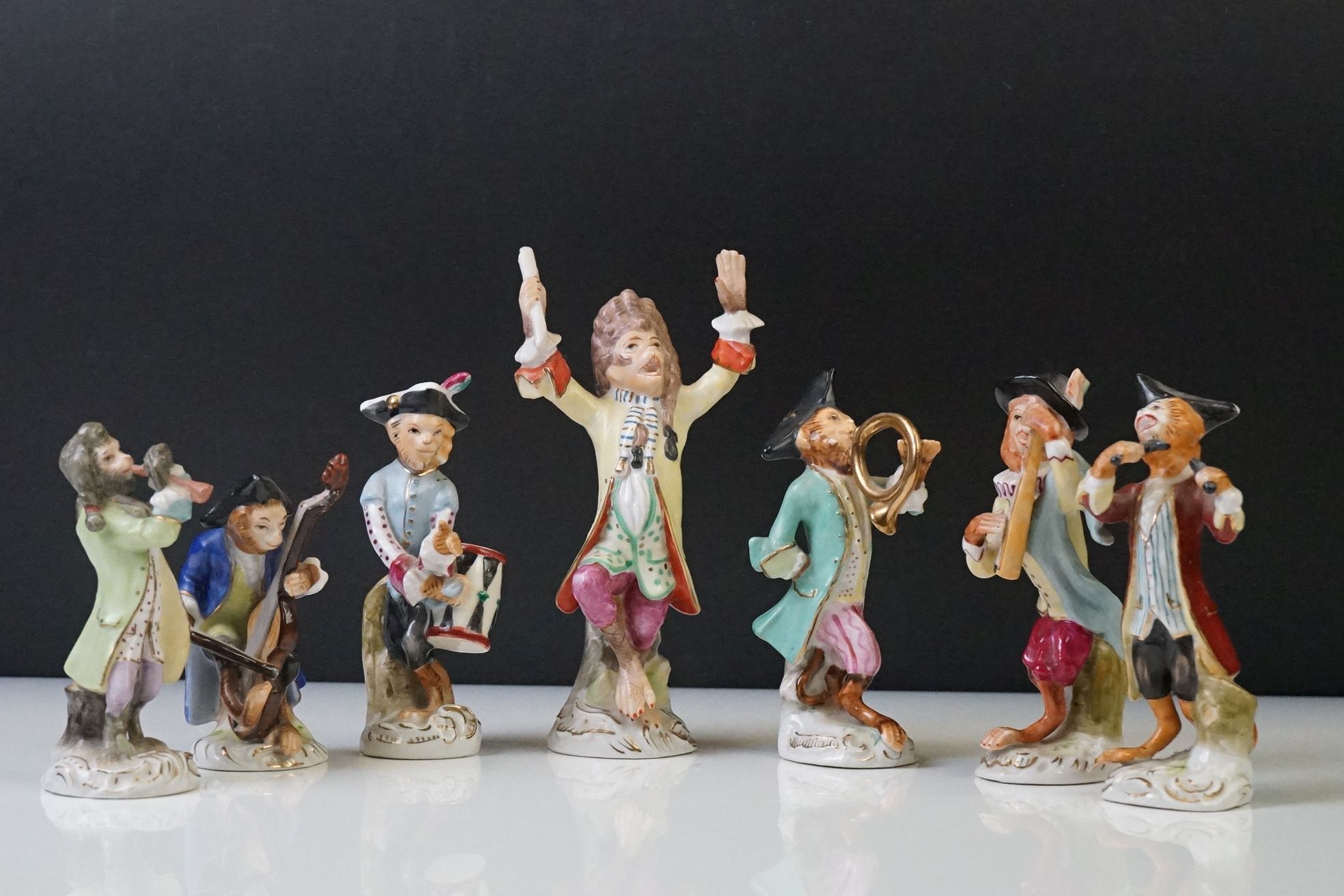 20th Century Sitzendorf Seven Piece Porcelain Monkey band, consisting of a conductor and six