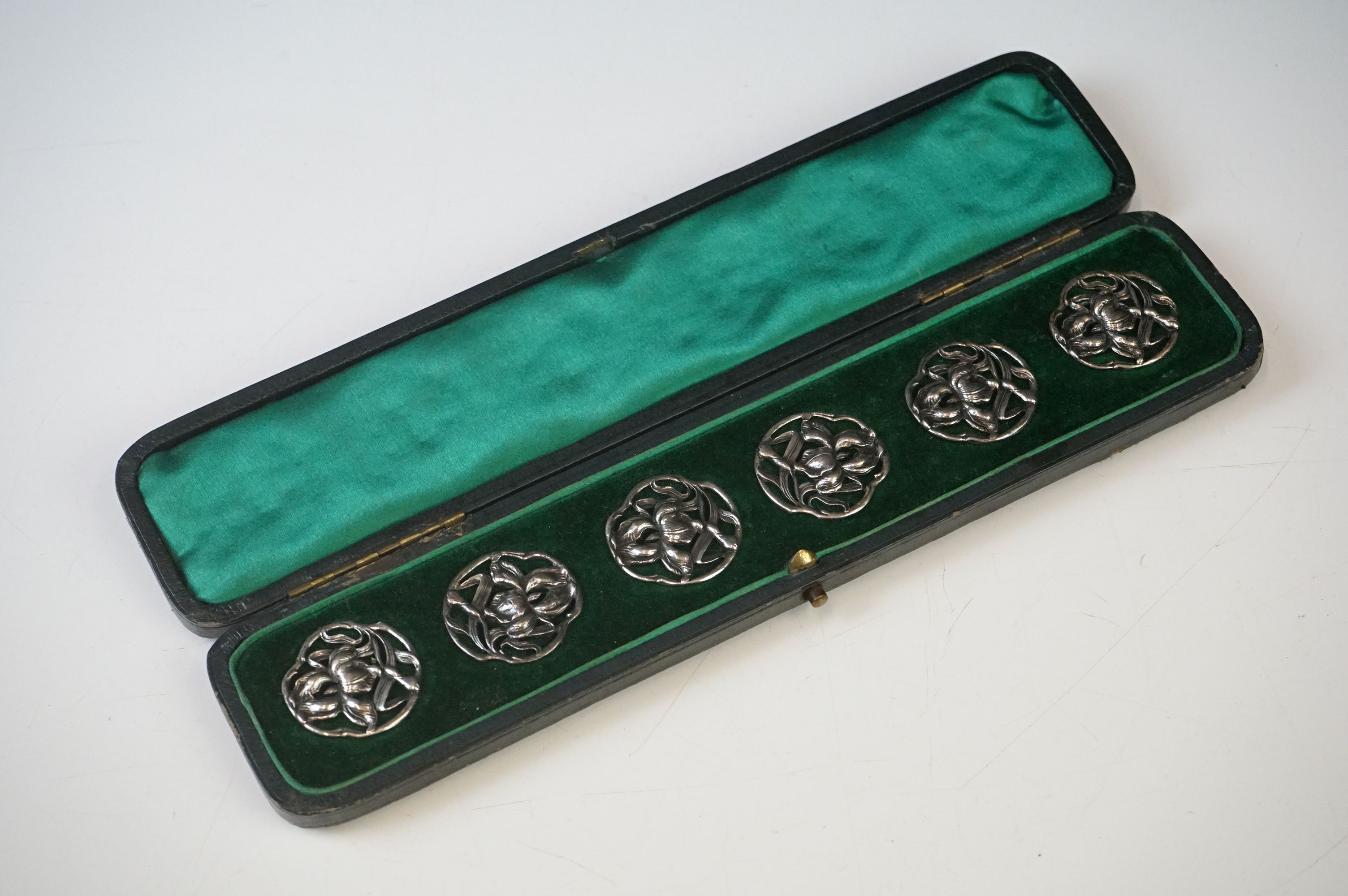 A cased set of six fully hallmarked sterling silver buttons, maker marked for James Deakin & Sons (