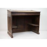 Victorian Oak Clerk's Desk, sloping writing surface over a kneehole space with two shelves to sides,