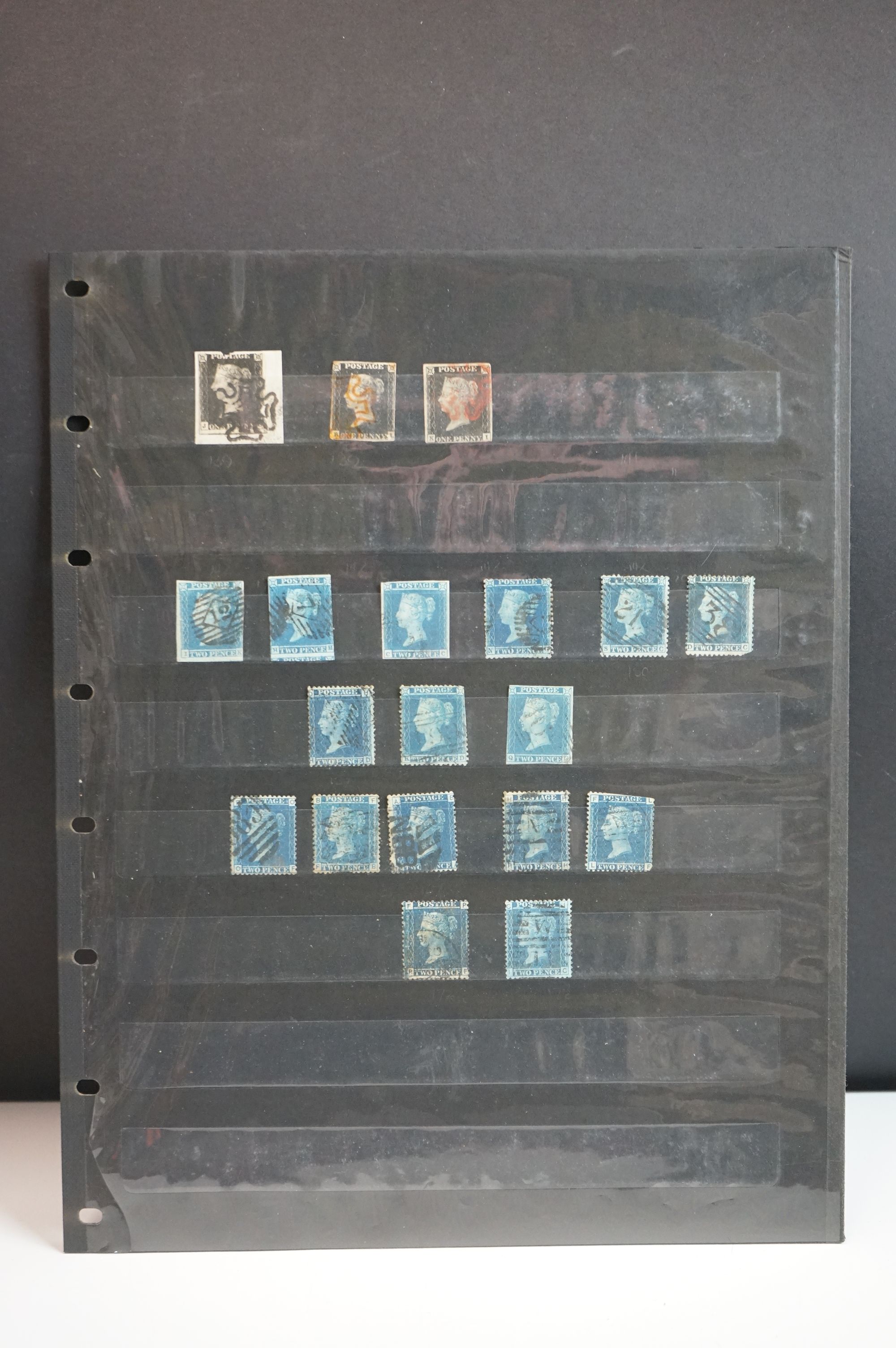 A collection of Queen Victoria Stamps to include three Penny Blacks, sixteen two penny blues and a