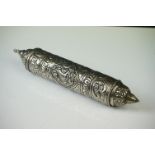 An Arabic white metal scroll holder ornate decoration.