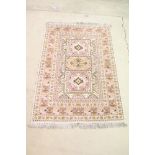 Moroccan Pink and Cream Ground Wool Rug with stylised geometric pattern, 184cm x 126cm