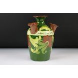 Four-stemmed Pottery Udder Vase, in the Torquay manner, with floral decoration and motto 'Do not