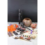 A group of tribal collectables to include carved wooden figures, bead work and jewellery.