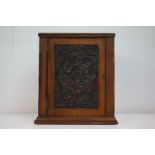 Late 19th / Early 20th century Small Oak Hanging Corner Cupboard, the single panel door carved