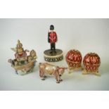 A collection of five decorative enamel trinket boxes.