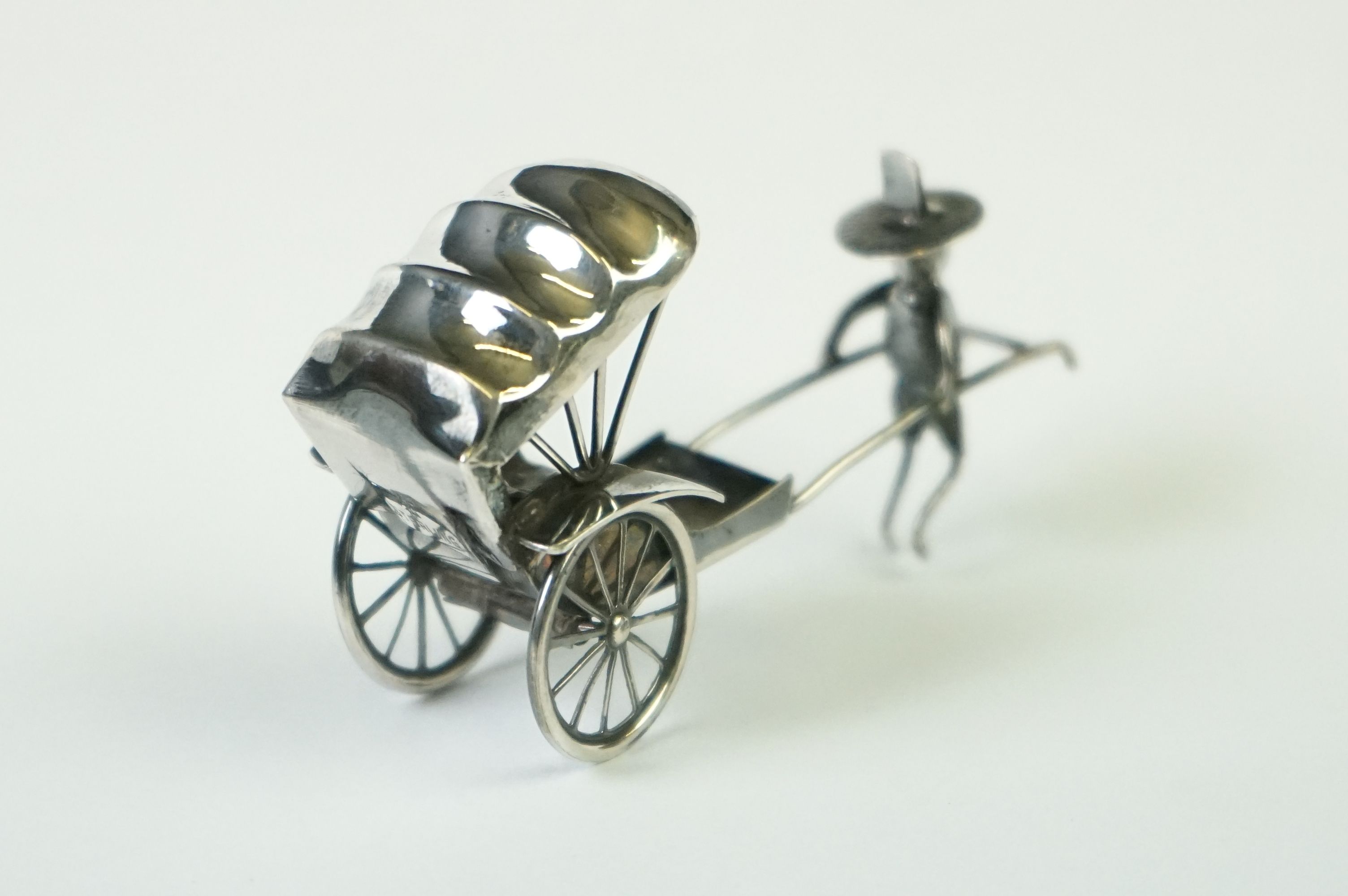 A Chinese sterling silver ornament of a man pulling a rickshaw. - Image 2 of 9
