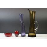 Three pieces of Whitefriars glassware to include a tall Smoky Grey Martini jug by Peter Wheeler...