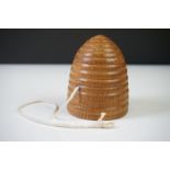 A vintage turned wooden string holder / dispenser in the form of a beehive.