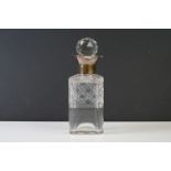 A cut glass decanter with fully hallmarked sterling silver collar, assay marked for London and dated
