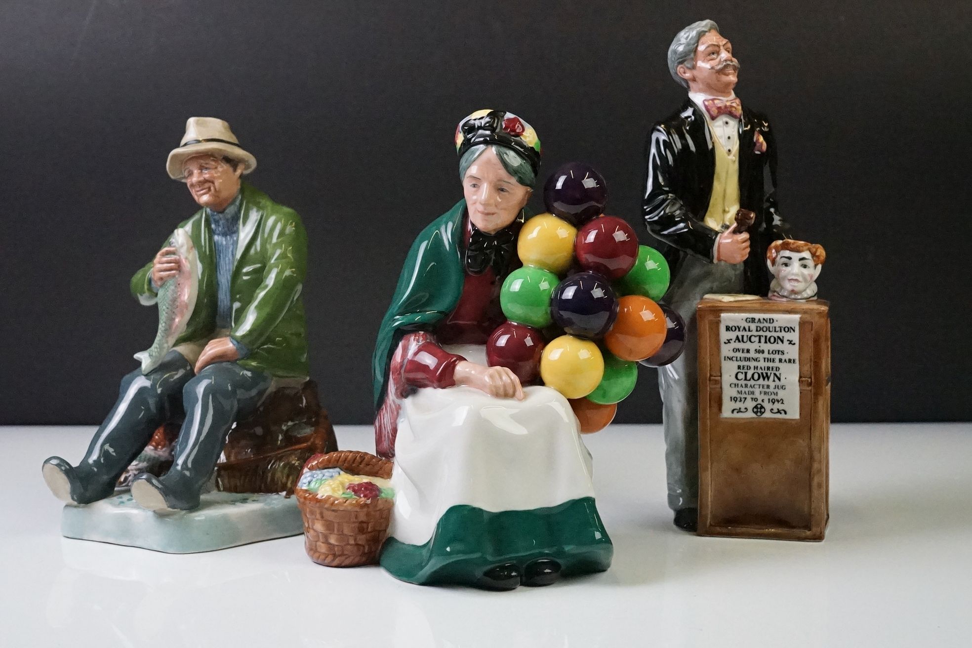 Three Royal Doulton porcelain figures to include ' The Auctioneer ' Collectors Club Exclusive (