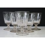 Six 19th Century Glass Rummers with facet-cut bowls, raised on knop stems above circular feet,