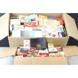 A large collection of empty cigarette packets dating from the 1970's onwards contained within two