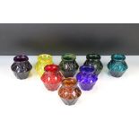 Set of Eight Victorian Moulded Glass Tea Light Holders of varying colours, with geometric diamond-