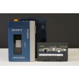 A Vintage 1980's Sony Walkman personal cassette player complete with blue leather case.