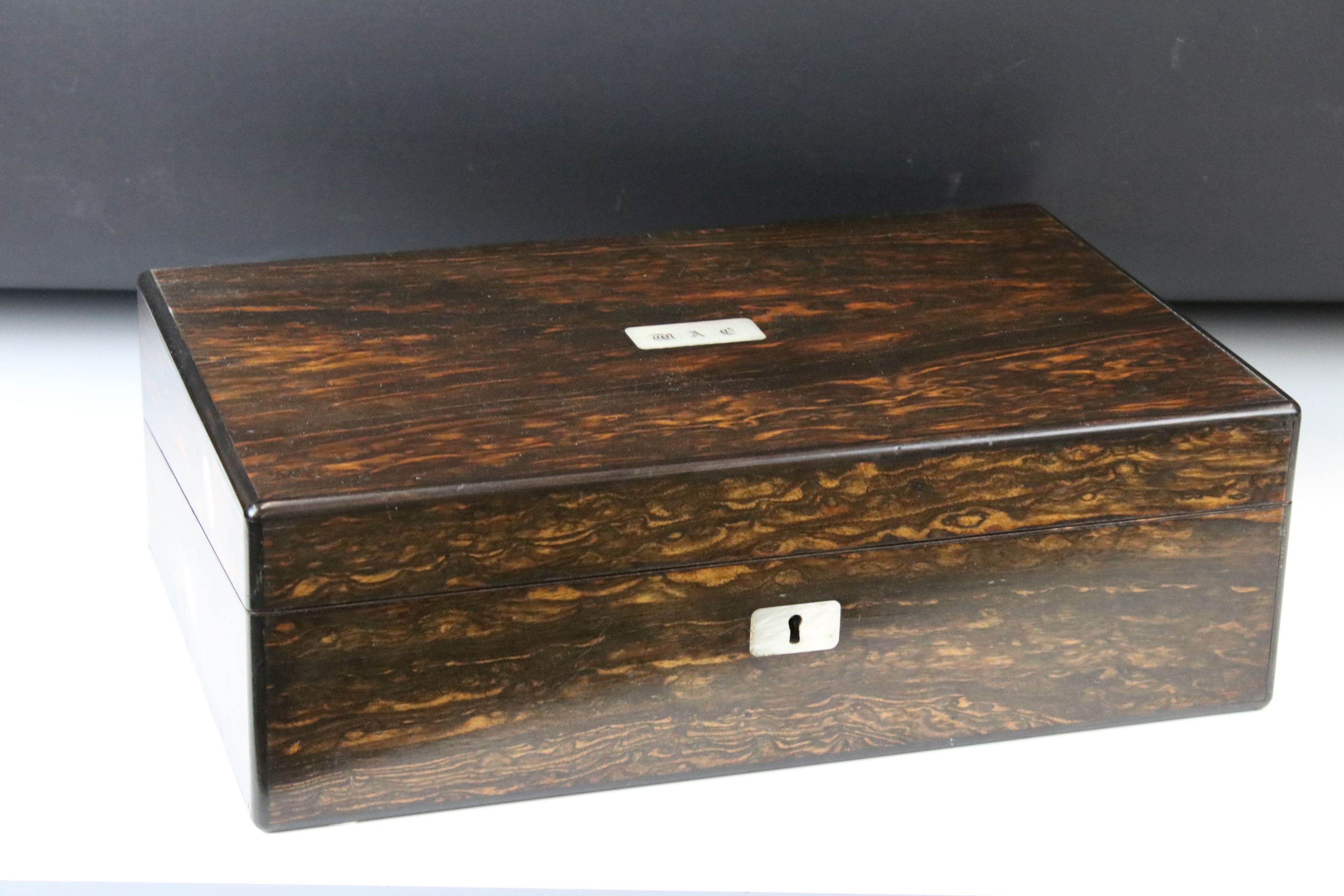 19th Century Coromandel writing slope with initialled MOP cartouche to lid, opening to reveal a