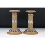 Pair of Late 19th Century Doulton Lambeth Silicon Ware candlesticks, of columnar form, relief