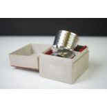 A pair of fully hallmarked sterling silver napkin rings with engine turned decoration and original