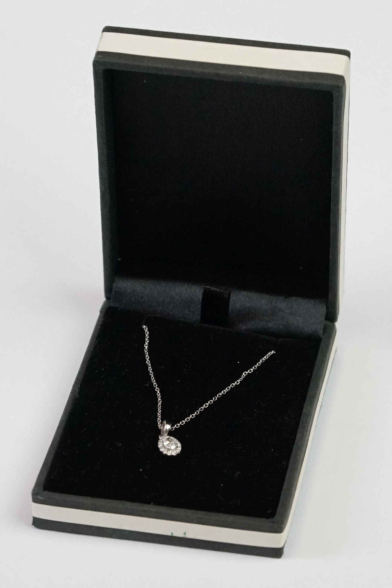 18ct White Gold Diamond Pendant of 25 points approx. total on gold chain