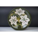 Moorcroft ' Bermuda Lily ' pattern green ground circular bowl, 25cm diameter